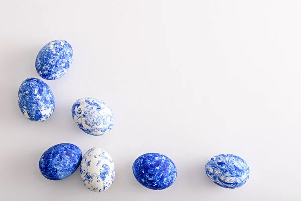 Top view Easter eggs in the color of the year-classic blue with gradient effect on white background — 스톡 사진