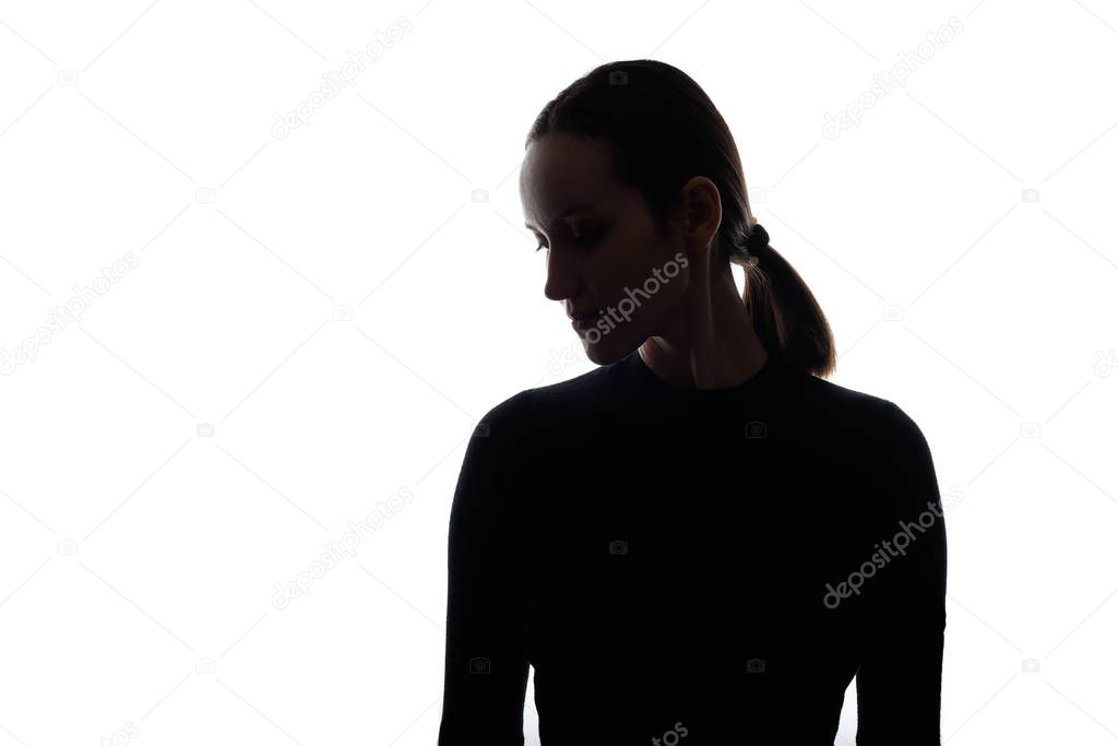 black and white silhouette portrait of caucasian woman with her head down