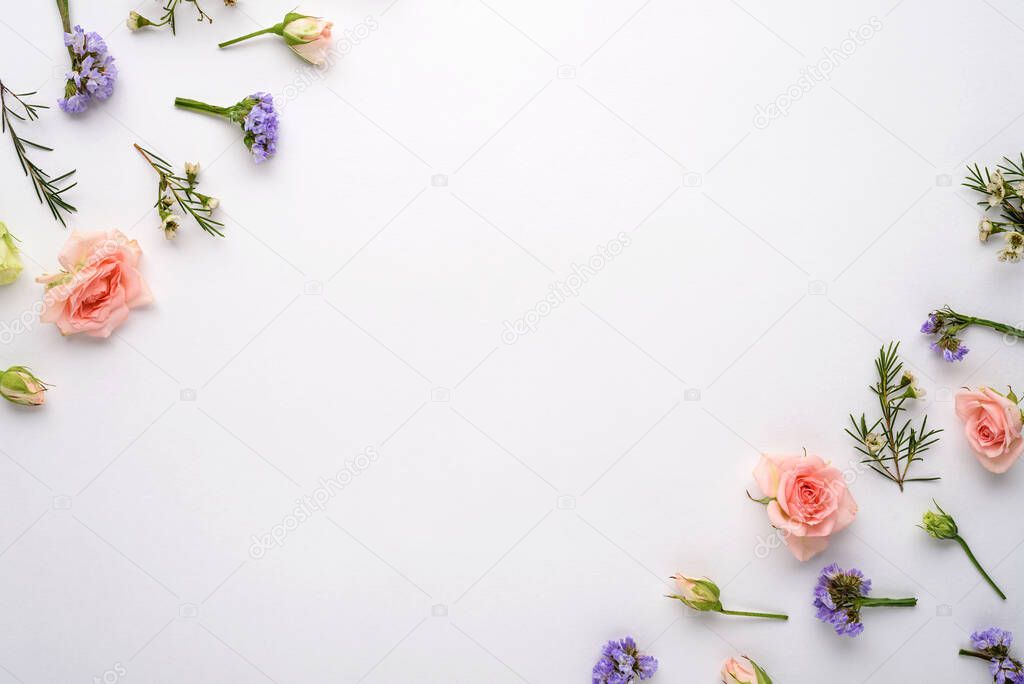 top view flower composition on white background, pink roses, eustoma, limonium in corners, flat lay, copy space, inflorescences concept