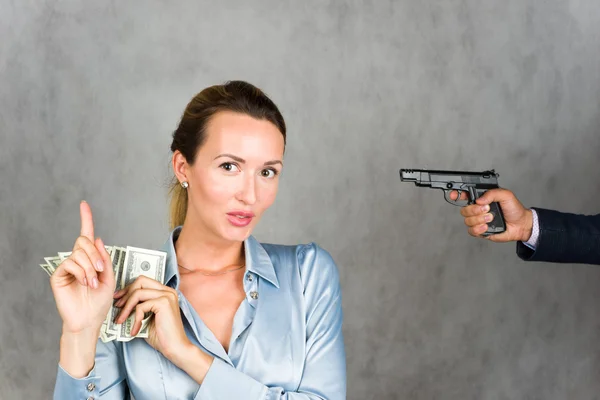 Girl pistol and dollars — Stock Photo, Image