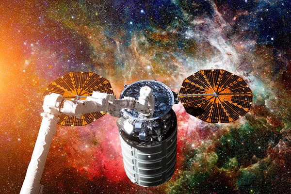 Cargo spacecraft - The Automated Transfer Vehicle over nebula.