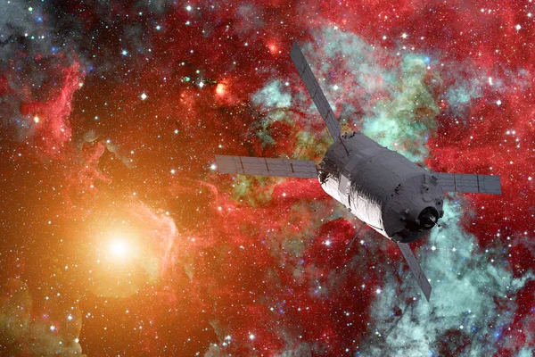 Cargo spacecraft - The Automated Transfer Vehicle over spiral galaxy.