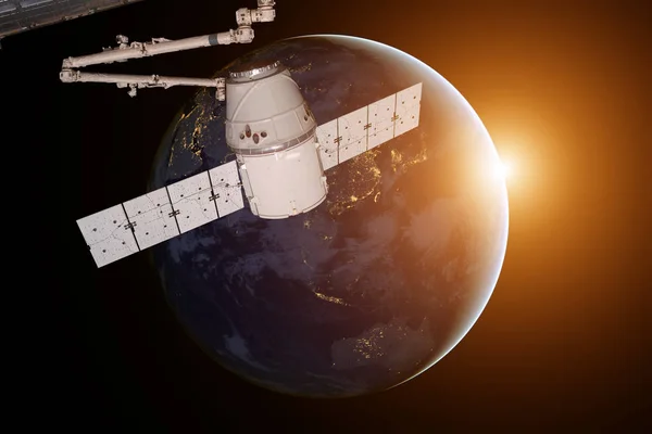 SpaceX Dragón orbitando el planeta Tierra. —  Fotos de Stock