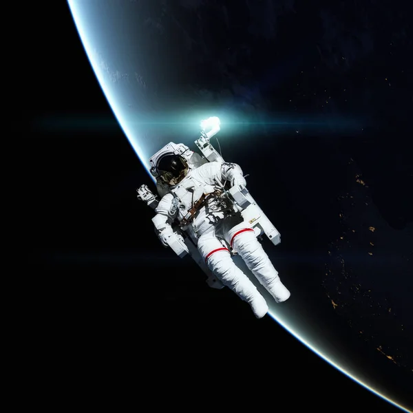 Astronautów w przestrzeni kosmicznej. Planeta Ziemia na tle. — Zdjęcie stockowe