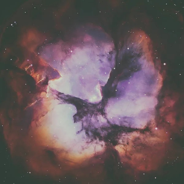 The Trifid Nebula is an H II region located in Sagittarius. — Stock Photo, Image