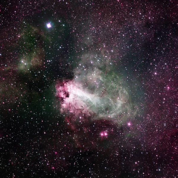 Star-forming region Messier 17, Omega Nebula or Swan Nebula .