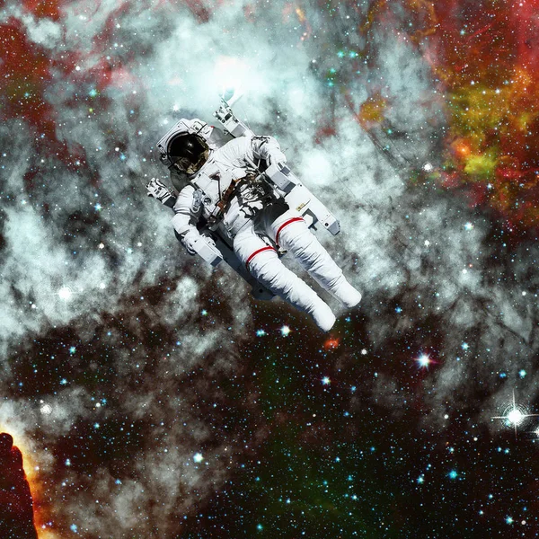 Astronaut in outer space. Nebula on the background. — Stock Photo, Image