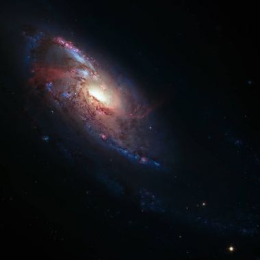 NGC 4258 av köpekleri takımyıldızı yönünde bulunan bir sarmal gökada.