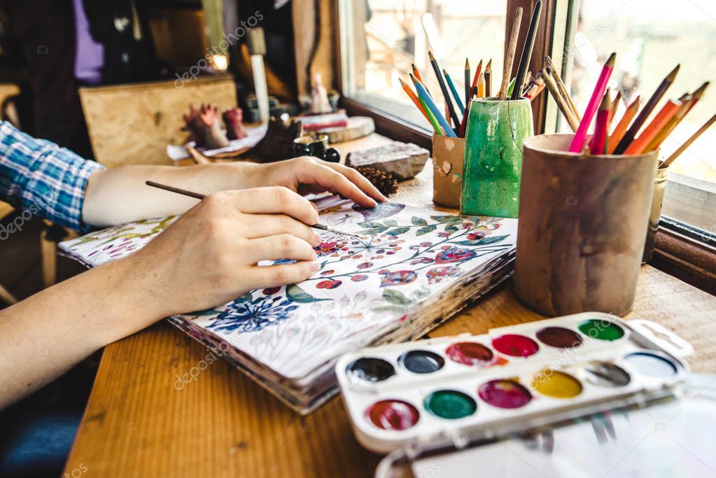 Girls hands with brush painting