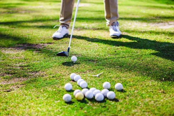 Golfplayer y bolas Imagen de stock