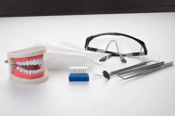 Tool of professional dentist on a white background — Stock Photo, Image