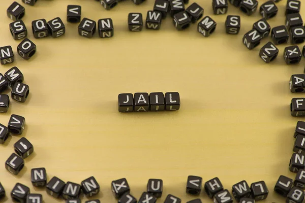 The word jail on wood background — Stock Photo, Image