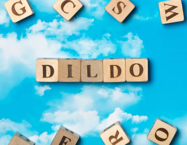 The word dildo on the sky background