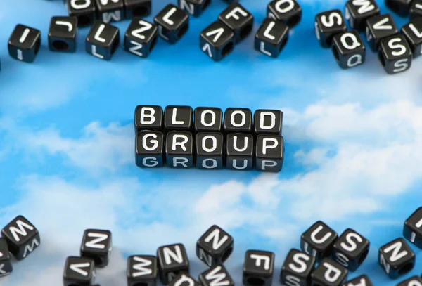 The word Blood group on the sky background Stock Picture