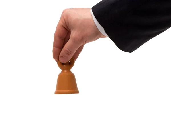 La mano con una campana sobre un fondo blanco — Foto de Stock