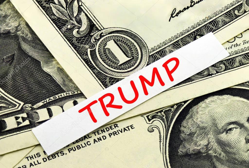 The word Trump against the background of dollars