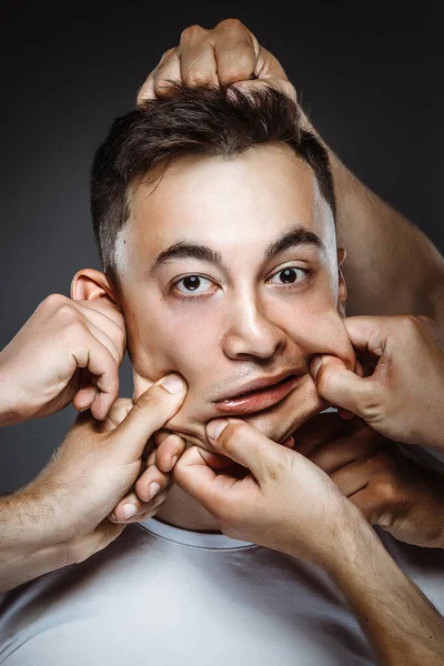 Hands Tearing Young Man Studio Shoot — Stock Photo, Image