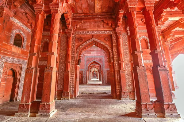 Fatehpur Sikri medieval mughal architecture built in the year 1569 made of red sandstone with intricate ancient wall art at Agra, India