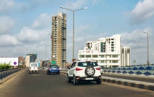 Indian cityscape buildings with view of over bridge with city traffic at Kolkata.