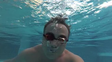 Sportive Young Man In The Swimming Pool Underwater View Vacation Summer Time Action Sportive Young Man In The Swimming Pool Underwater View Vacation Summer Time Action