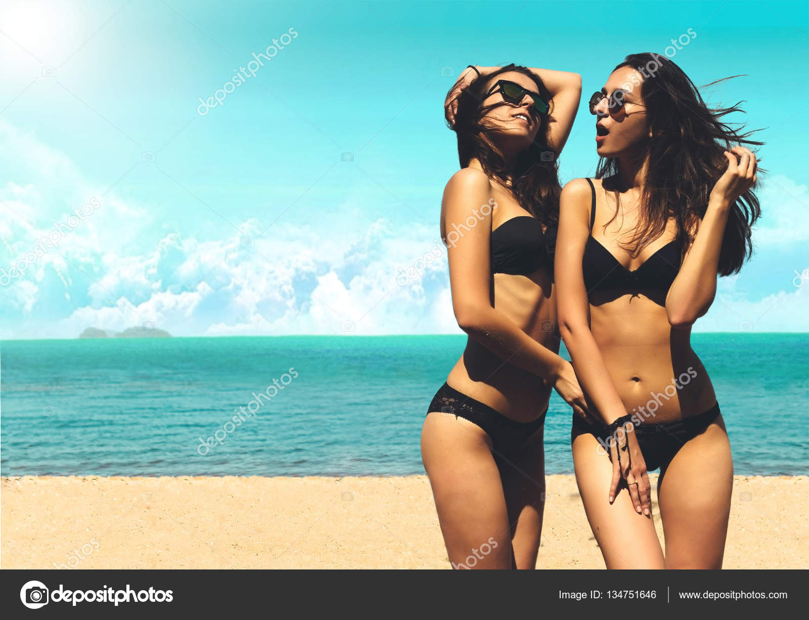 Two Sexy Women in Bikinis on the Sunny Beach. Best Friends Having Fun, Summer vacation holiday Lifestyle