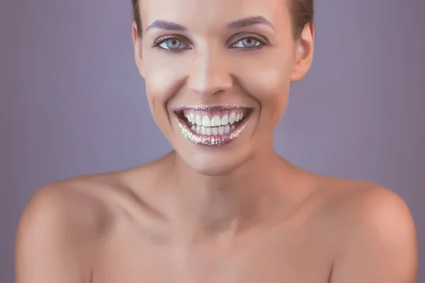 Perfect teeth smile with tinsel lips. Beautiful close up tanned Face of Young Woman with Clean Fresh Skin in retro style. Beautiful Spa Woman Smiling. Perfect Fresh Skin. Youth and Skin Care Concept
