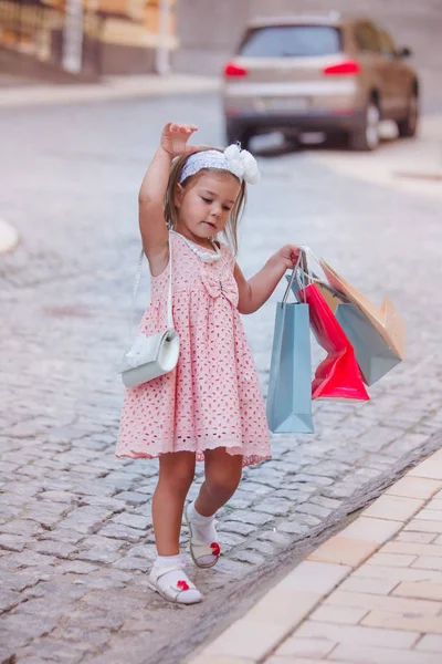 Little Girl with some shopping bags