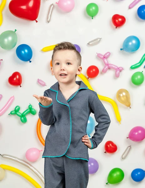 Boy in the background of balls — Stock Photo, Image