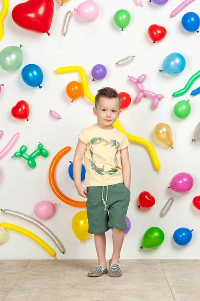 Boy in the background of balls — Stock Photo, Image