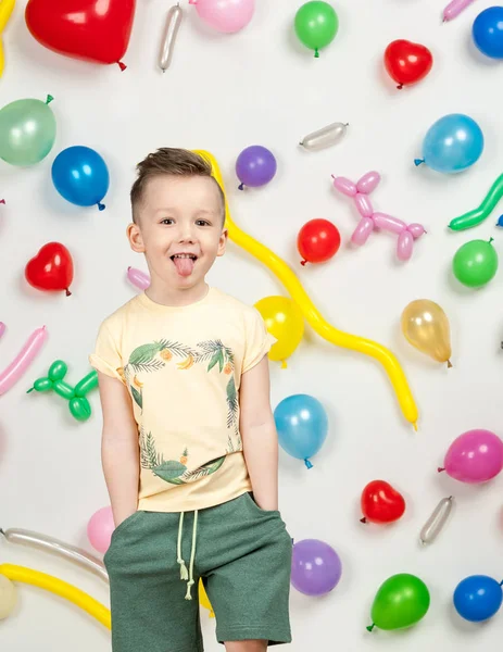 Boy in the background of balls — Stock Photo, Image