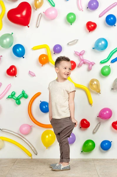 Boy in the background of balls — Stock Photo, Image