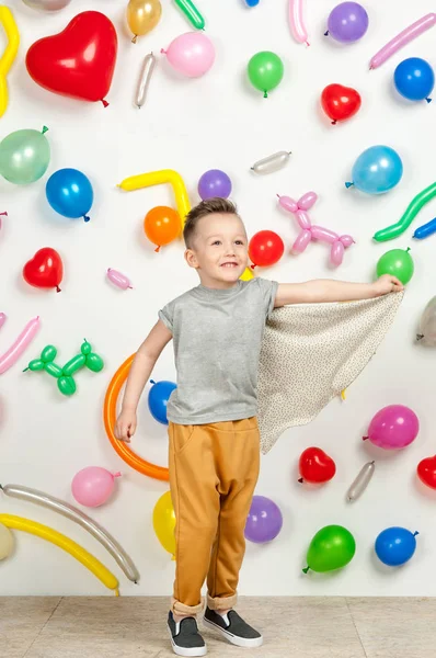 Boy in the background of balls — Stock Photo, Image