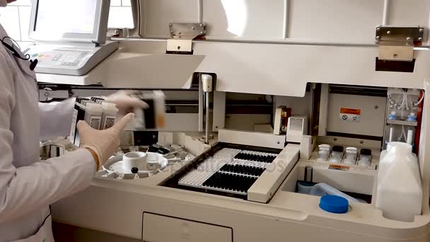 Girl Lab Puts Serum Samples Medical Device Analysis Machine Automatic — Stock Video