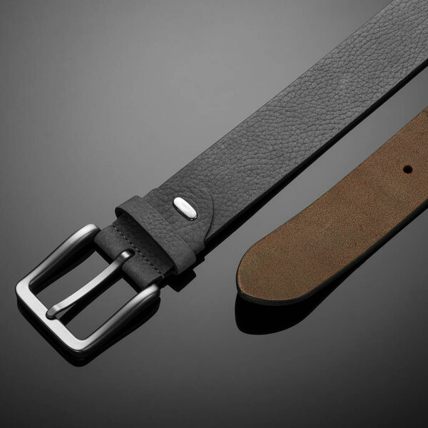 fashionable black leather men's belt on black background