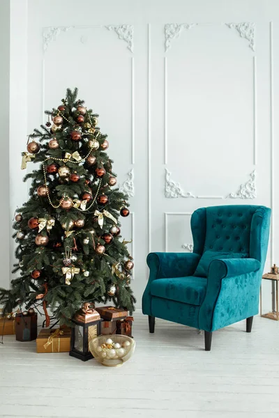 Simple Christmas living room with armchair and Christmas tree