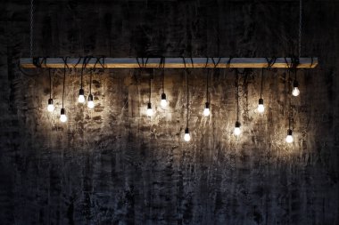 Karanlık doku arka plan üzerinde Işık Ampüller