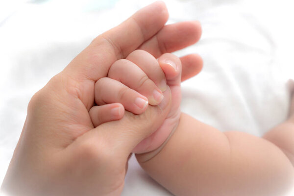 close-up hand of baby in the hand of mother. 