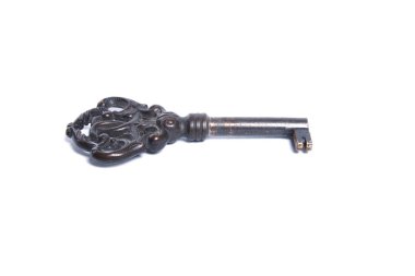 Closeup of an old key, showing heavy usage marks. Isolated on white.