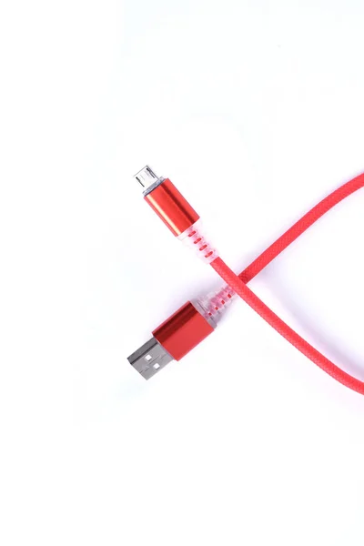 Red USB cable for smartphone charge isolated on white background. — 스톡 사진