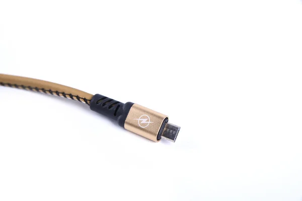 Folded USB lightning charging smartphone golden cable isolated over the white background — 스톡 사진