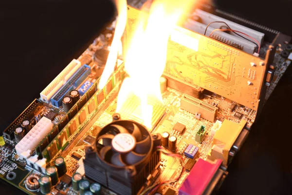 Fire Burning ,blazing computer motherboard, cpu,gpu and video card, processor on circuit board with electronic