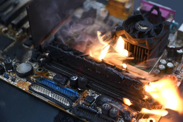 Fire Burning ,blazing computer motherboard, cpu,gpu video card, processor on circuit board with electronic