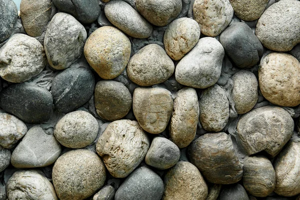 Guijarro marino. fondo de piedras marinas. rocas de playa . — Foto de Stock