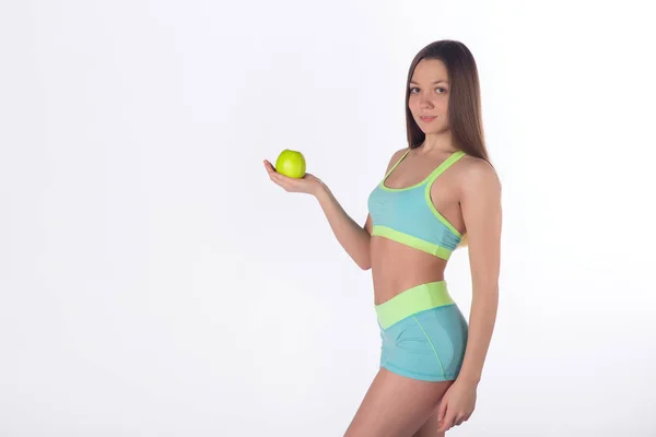 Atrakcyjne fitness kobieta pozuje z apple — Zdjęcie stockowe