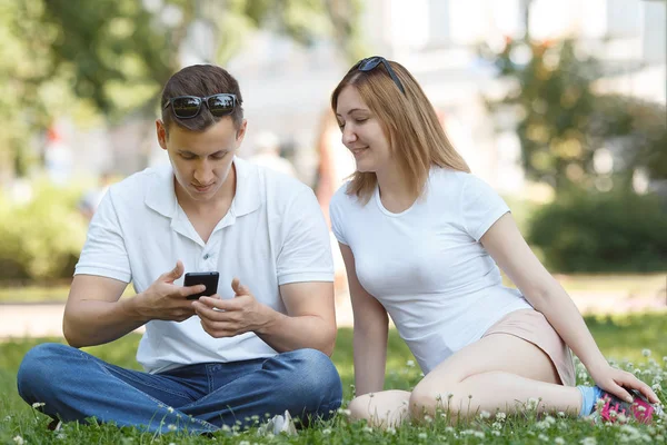 Man looking at their mobile phone while on a date