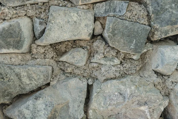 Textura de granito, primer plano de la superficie de la pared de piedra — Foto de Stock