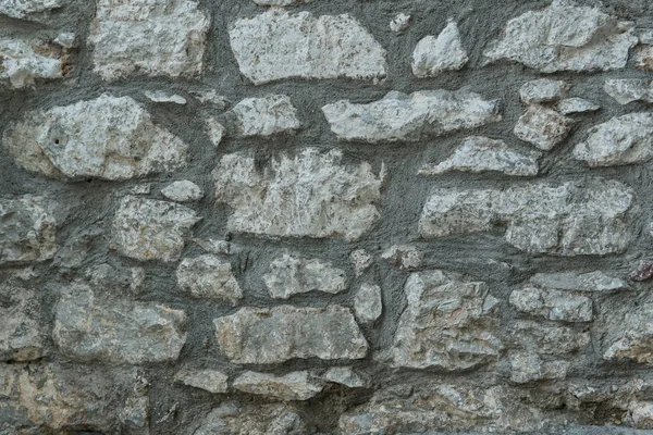 Textura de granito, primer plano de la superficie de la pared de piedra — Foto de Stock