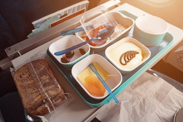 food served on a tray in airplane during flight