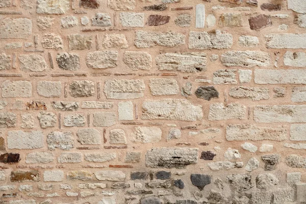 Pared del edificio histórico está hecho de diferentes piedras. Textura — Foto de Stock