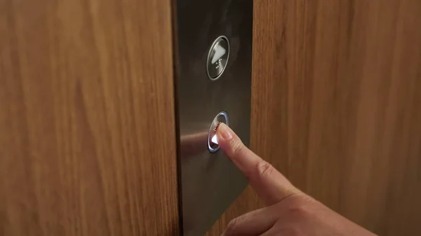 Hand presses elevator button to go down extreme close view — Stock Photo, Image